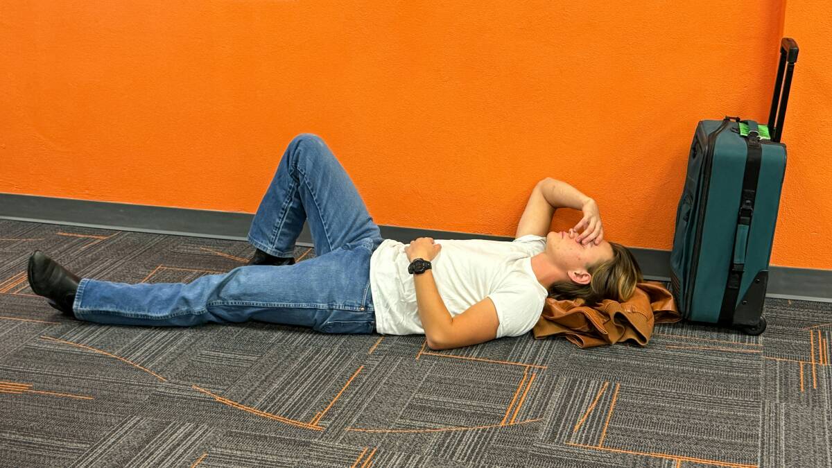 A tired passenger stretches out on the floor of a terminal gate. Picture Donald Merrill/Unsplash A tired passenger stretches out on the floor of a terminal gate. Picture Donald Merrill/Unsplash