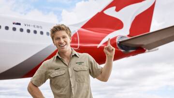 Australian conservationist Robert Irwin pictured in front of a Qantas plane. Picture supplied
