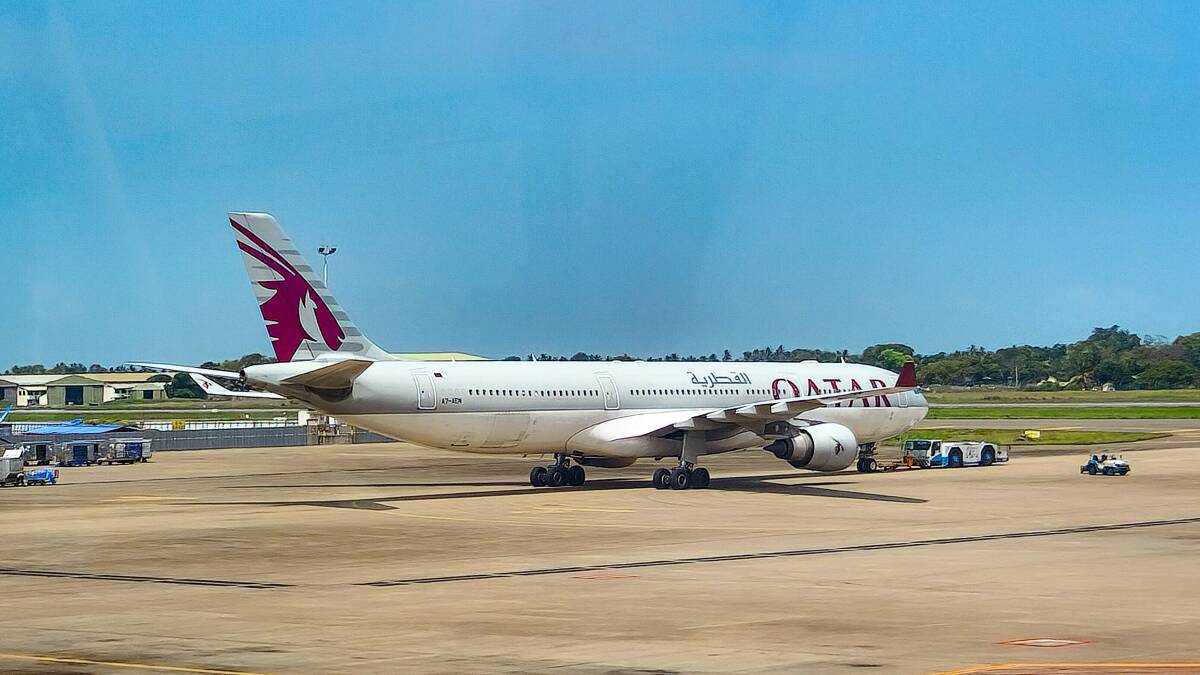 A Qatar Airways plane on the tarmac. Picture from Unsplash/Zoshua Colah A Qatar Airways plane on the tarmac. Picture from Unsplash/Zoshua Colah