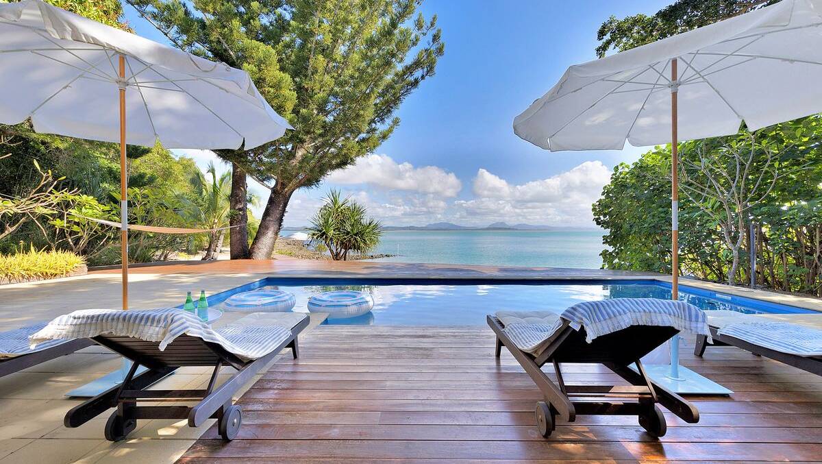 The residence boasts a pool with stunning views of the ocean. 