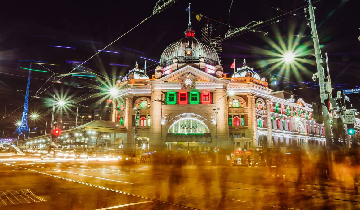 Melbourne's Flinders Street Station lit up in Christmas lights. Picture: Unsplash Melbourne's Flinders Street Station lit up in Christmas lights. Picture: Unsplash