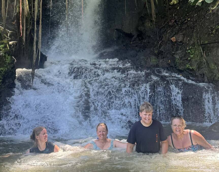 Cooling off at the Uma Anyar Waterfall south of Ubud.
