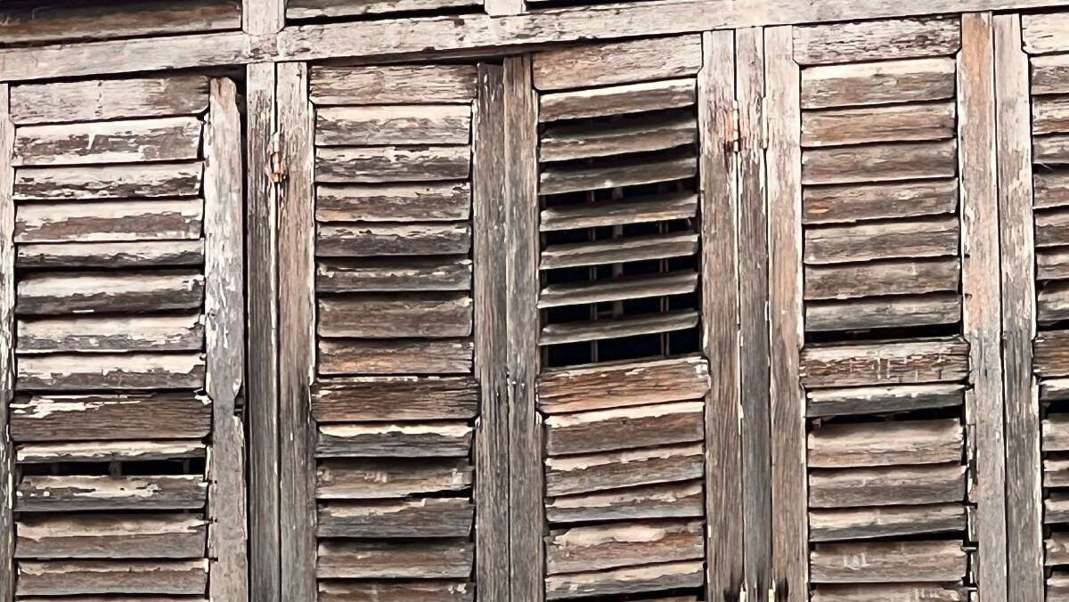 Weathered shutters whisper in old George Town. Picture: John Hanscombe Weathered shutters whisper in old George Town. Picture: John Hanscombe