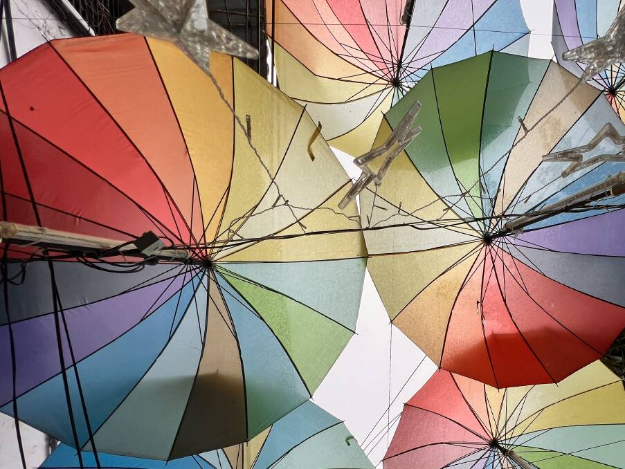Colourful umbrellas strung over a laneway in George Town. Picture: John Hanscombe Colourful umbrellas strung over a laneway in George Town. Picture: John Hanscombe
