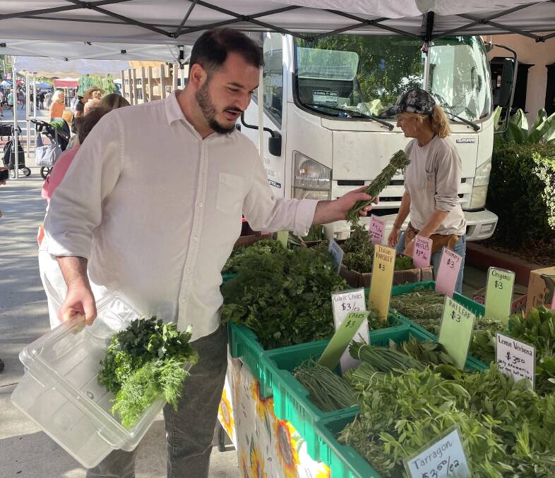 Bouchon Santa Barbara chef Vicken Tavitian selects herbs at the farmers' market. Picture by James Gardiner