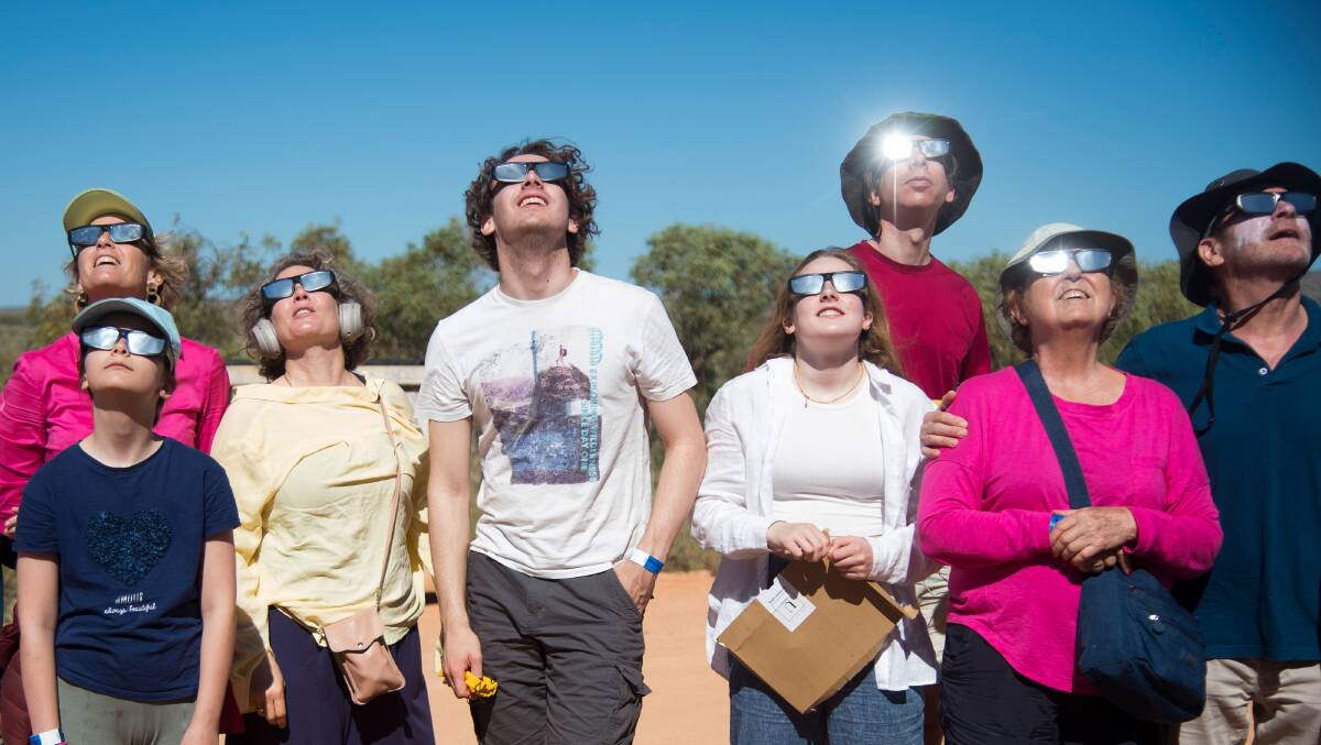 People gather for a total solar eclipse at a viewing site 24km from Exmouth, Western Australia, on April 20, 2023. Picture by AAP Image/Aaron Bunch