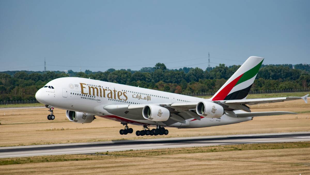 An Emirates aircraft takes off. Picture from Unsplash/Tim Dennert