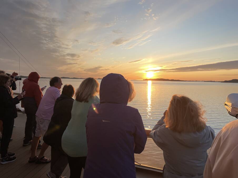 Viking Jupiter passengers watch the midnight sun while crossing the Arctic Circle. Picture by Sarah Falson