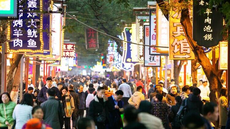 Crowds and eateries in China. Picture by Intrepid Travel
