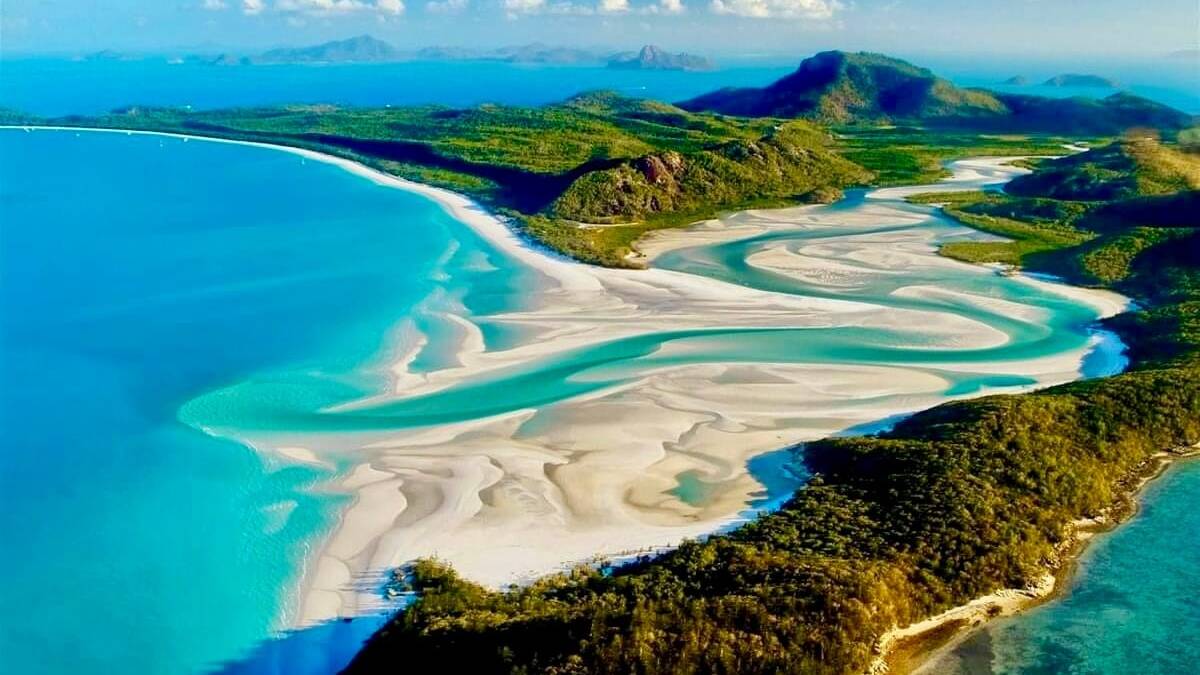 The view from a Heart Reef Scenic Flight above Airlie Beach. Picture by Gemma Lytwyn/Tourism and Events Queensland