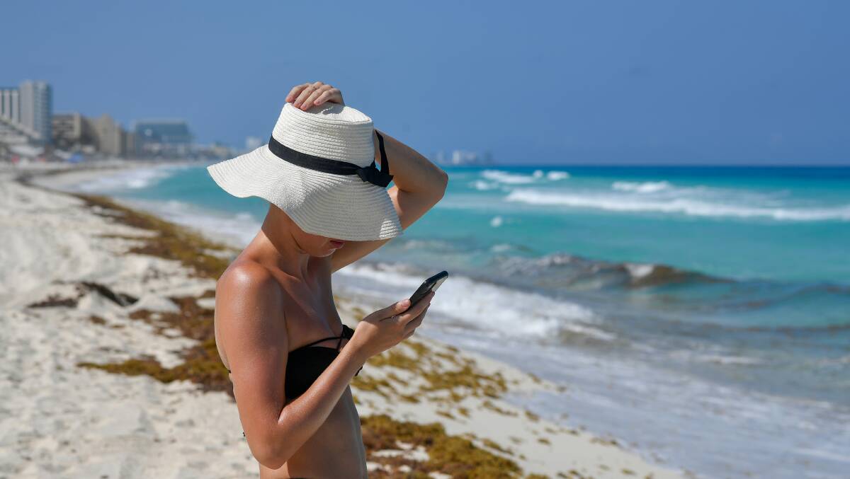 Are you checking work emails on holidays? You need to give your brain a break and boost your wellbeing. Picture by Margo Evardson