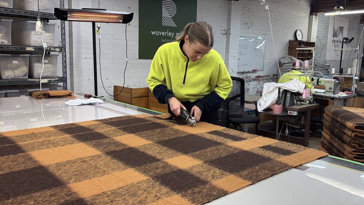 A worker trims a blanket at Waverley Mills. Picture by Sarah Falson A worker trims a blanket at Waverley Mills. Picture by Sarah Falson
