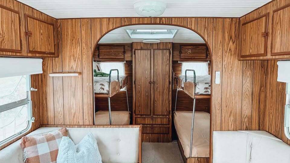 Vintage wood panelling in 'Queenie', a vintage caravan for hire on Camplify.