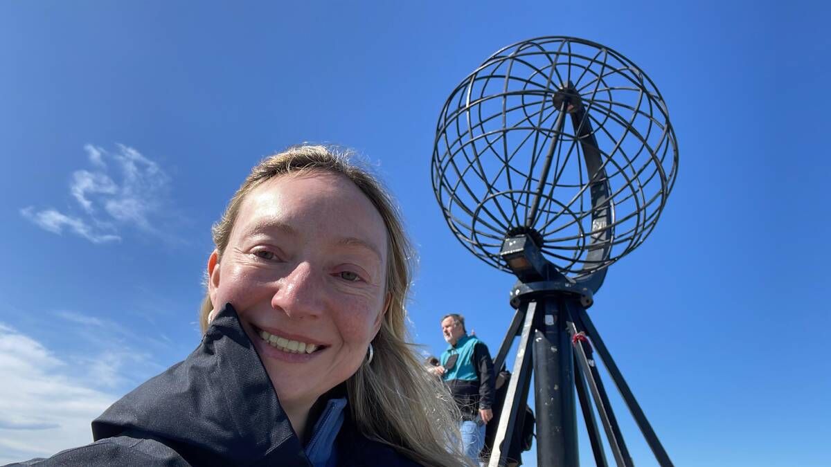 The writer with the North Cape globe monument. Picture by Sarah Falson