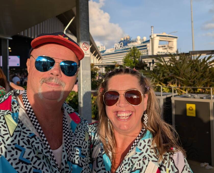 Brisbane resident Leisa Hassall and her husband on the dock with the P&O Cruises Pacific Encounter behind them. Brisbane resident Leisa Hassall and her husband on the dock with the P&O Cruises Pacific Encounter behind them.