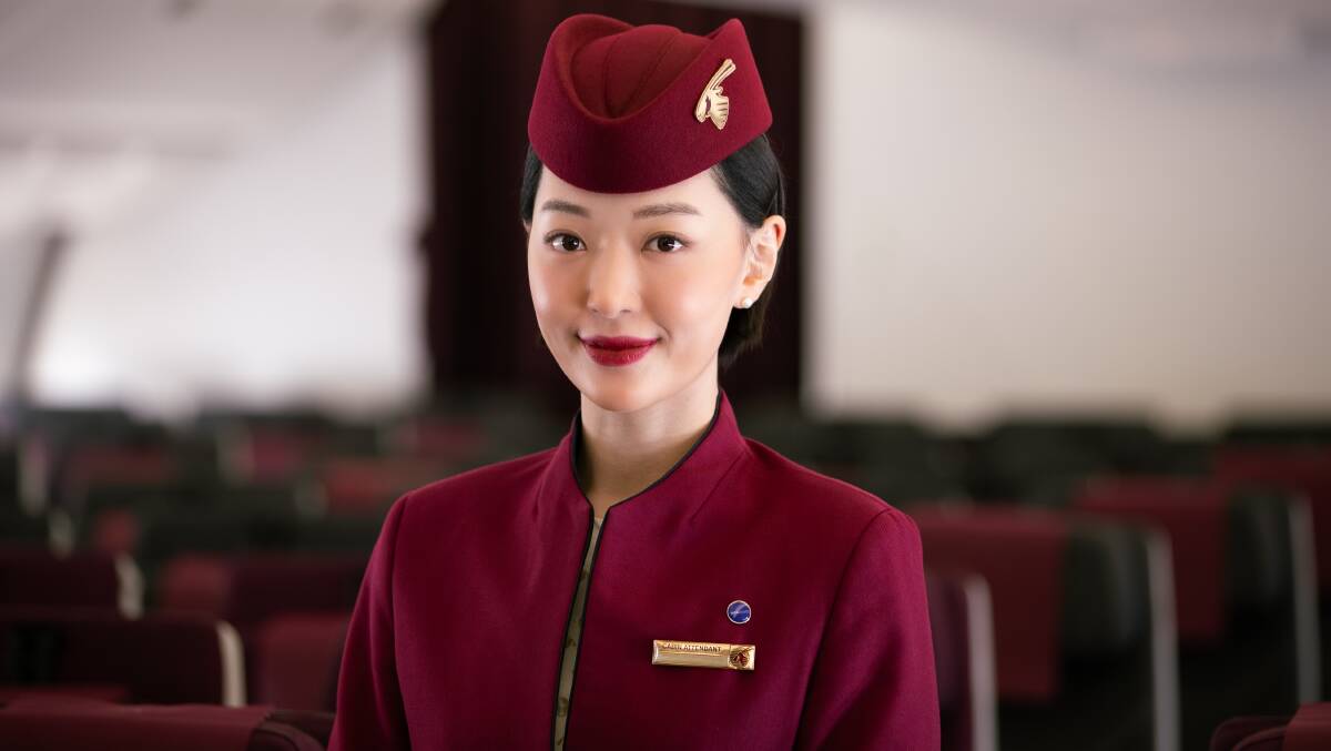 A Qatar Airways cabin crew member.