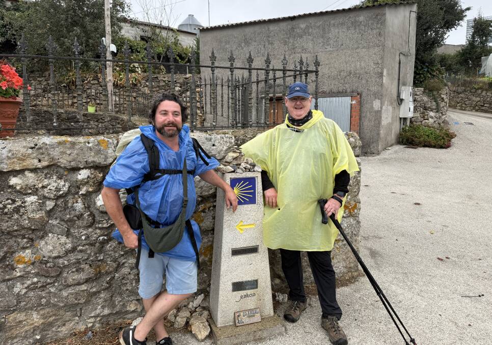 Seasoned walker David Box (right in yellow) with a French traveller, Guillame, on the Camino trail. Pictures supplied