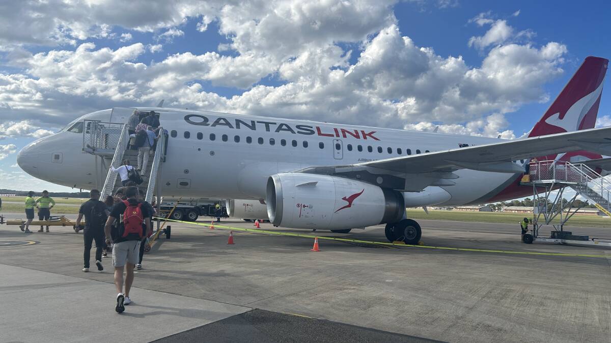 The QantasLink Airbus A319 on the tarmac at Newcastle Airport. The QantasLink Airbus A319 on the tarmac at Newcastle Airport.