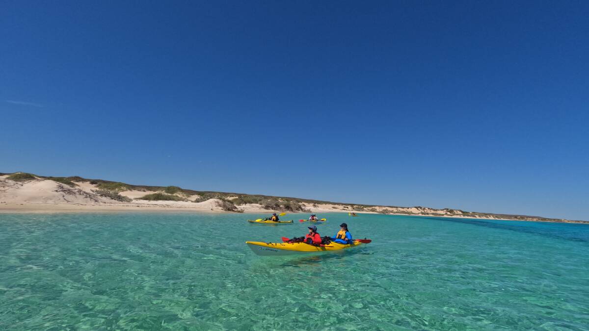 Paddling along the remote Ningaloo Reef coastline. Picture: Sea Kayak Jervis Bay Paddling along the remote Ningaloo Reef coastline. Picture: Sea Kayak Jervis Bay