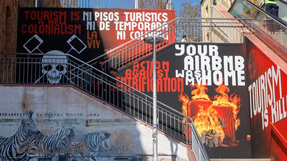 Street art in Catalonia, Spain, protesting mass tourism. Picture Shutterstock