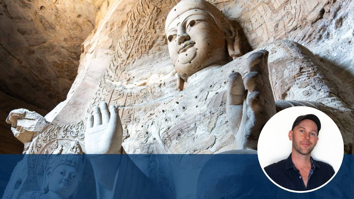 One of the carved statues inside the Yungang Grottoes. Picture by Michael Turtle