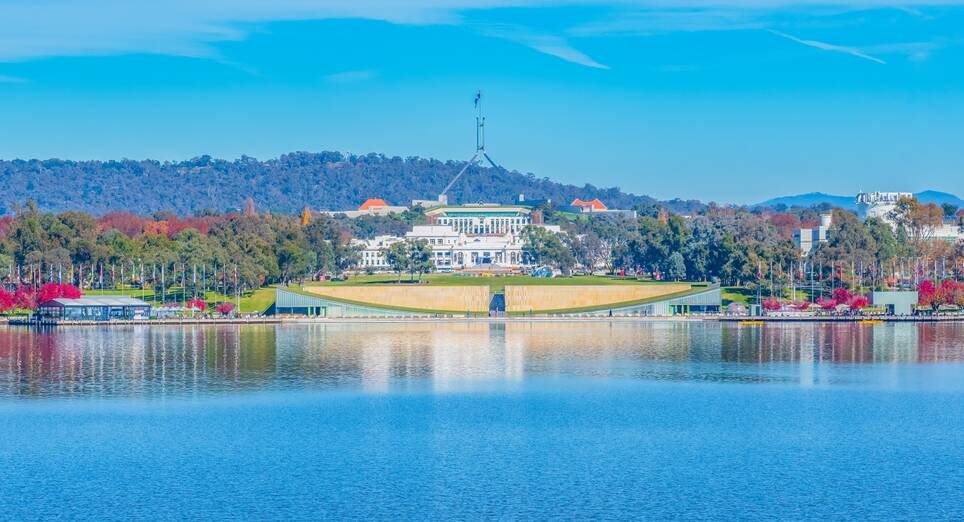 Parliament House seen from Lake Burley Griffin in Canberra. Picture Shutterstock Parliament House seen from Lake Burley Griffin in Canberra. Picture Shutterstock