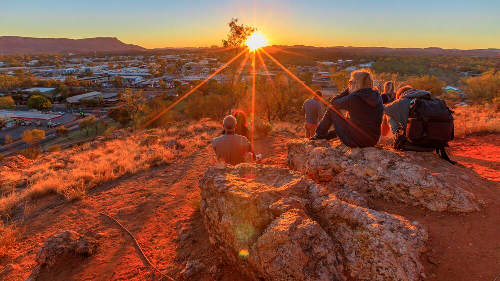 Sunset at Anzac Hill War Memorial overlooking Alice Springs. Picture Shutterstock