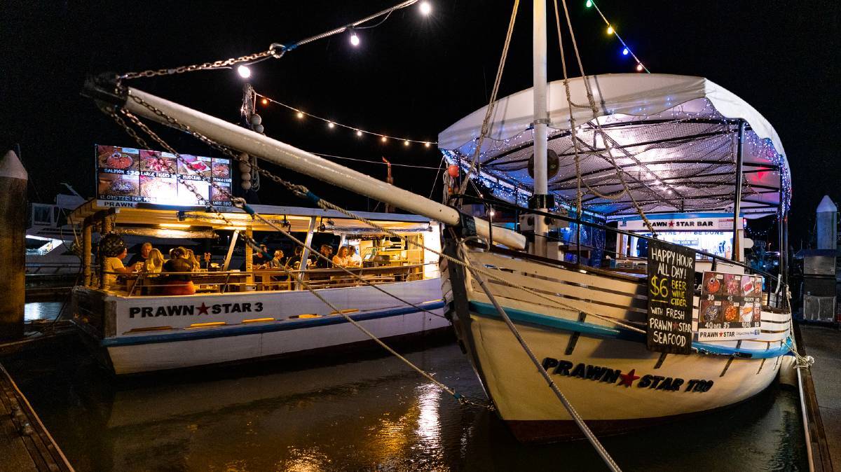 Prawn Star serves seafood platters on old trawlers.