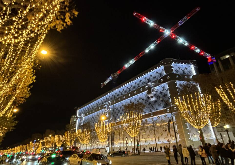 The lights - and Louis Vuitton's gigantic monogrammed trunk - on the Champs Elysées. Picture by Kate Cox