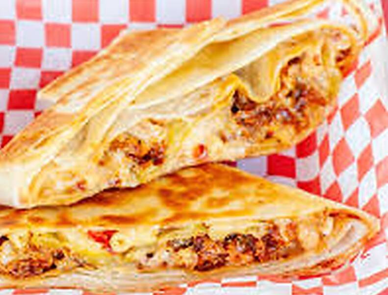 The Hot Chicken Mac and Cheese Crunchwrap is a viral - and messy - dish. Picture supplied