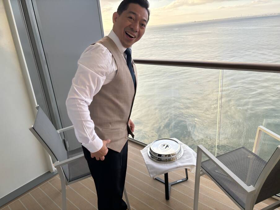 Clark delivers breakfast on the balcony.
