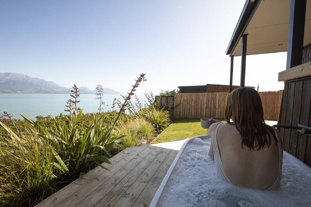 Outdoor bath time at the Clifftop Cabins in Kaikoura. Picture: Supplied Outdoor bath time at the Clifftop Cabins in Kaikoura. Picture: Supplied
