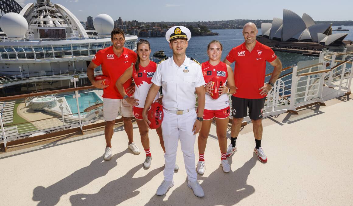 Crown Princess captain Mario Consentino, from Italy, was game enough to kick the Sherrin with Swans Josh Kennedy, Chloe Molly, Cynthia Hamilton and Tom Harley. Crown Princess captain Mario Consentino, from Italy, was game enough to kick the Sherrin with Swans Josh Kennedy, Chloe Molly, Cynthia Hamilton and Tom Harley.