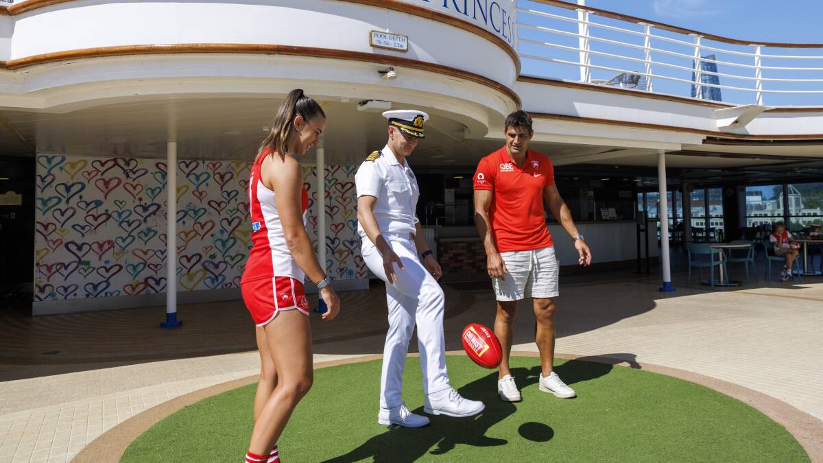 Hamilton and Kennedy give Consentino some pointers on his drop punt. Hamilton and Kennedy give Consentino some pointers on his drop punt.