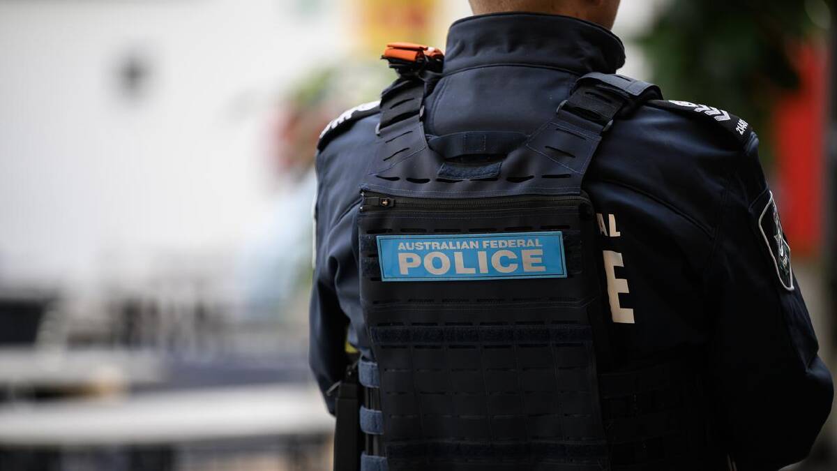 Australian Federal Police boarded the plane and arrested a Montenegro national. (Bianca De Marchi/AAP PHOTOS)