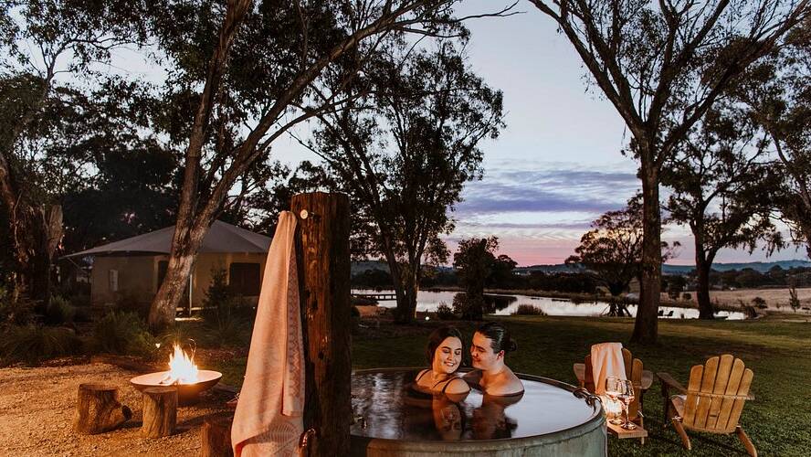 A couple enjoying a dip in the hot tub at Evamor Valley in Mudgee. Picture supplied / Amber Creative A couple enjoying a dip in the hot tub at Evamor Valley in Mudgee. Picture supplied / Amber Creative