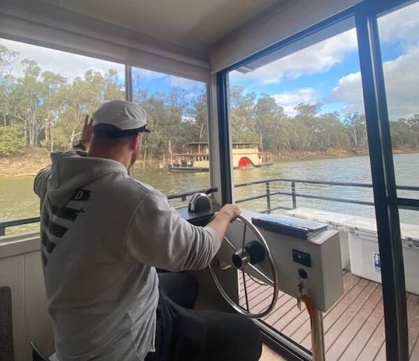 Steering the Murray River Houseboat proved simple and fun. Picture by Tig Powell-Mardling Steering the Murray River Houseboat proved simple and fun. Picture by Tig Powell-Mardling