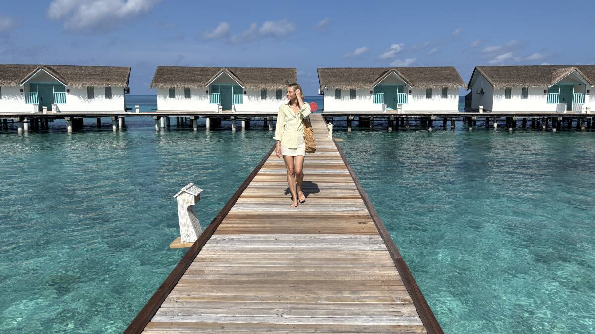 A woman walking near the overwater villas at NH Collection Maldives Reethi Resort. Picture by Nadine Morton A woman walking near the overwater villas at NH Collection Maldives Reethi Resort. Picture by Nadine Morton