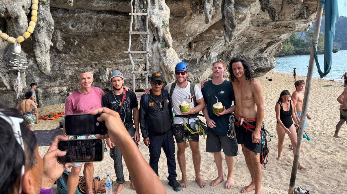 George Broadfoot, Hari Phongsopon, a representative from Hat Noppharat Thara Mu Ko Phi Phi National Park, James Harrington, Finn Irving and Justin Pang after the rescue cliff rescue at Tonsai in Krabi, Thailand on Wednesday, January 31. Picture supplied George Broadfoot, Hari Phongsopon, a representative from Hat Noppharat Thara Mu Ko Phi Phi National Park, James Harrington, Finn Irving and Justin Pang after the rescue cliff rescue at Tonsai in Krabi, Thailand on Wednesday, January 31. Picture supplied